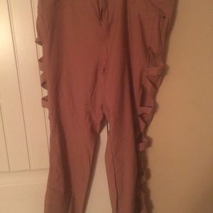 Pink denim pants with cut out sides